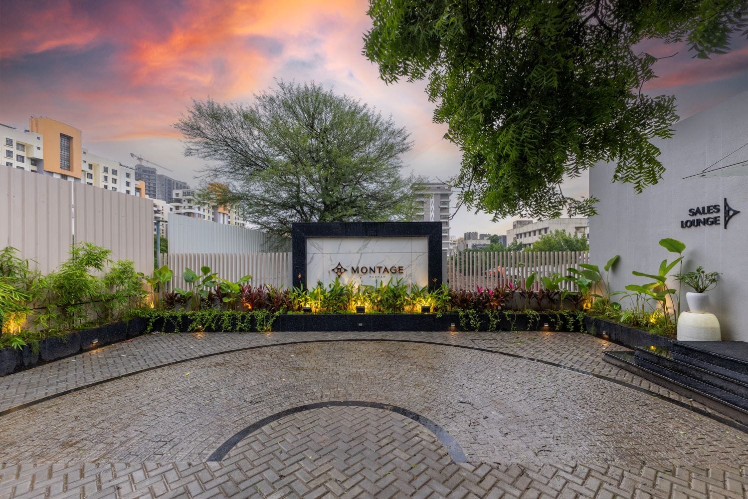 Commercial space designed by Metamorphic Interior Design Studio based in Pune, showcasing the entrance with lush greenery and modern architectural elements